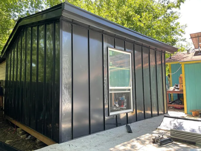 Black standing seam metal wall panels for Roof Inspection in River Forest